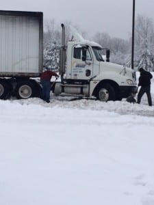 Capacity's Adam helps a semi dig out this afternoon.