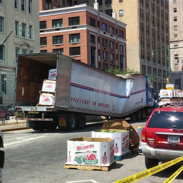 truck stuck under bridge
