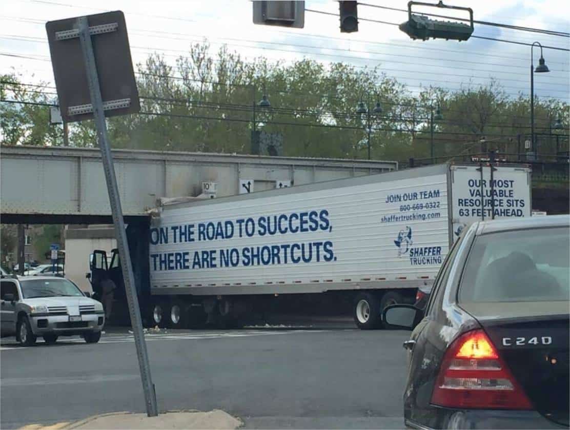 truck stuck under bridge