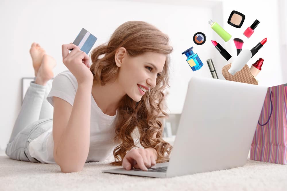 young woman browsing luxury brand e-commerce site