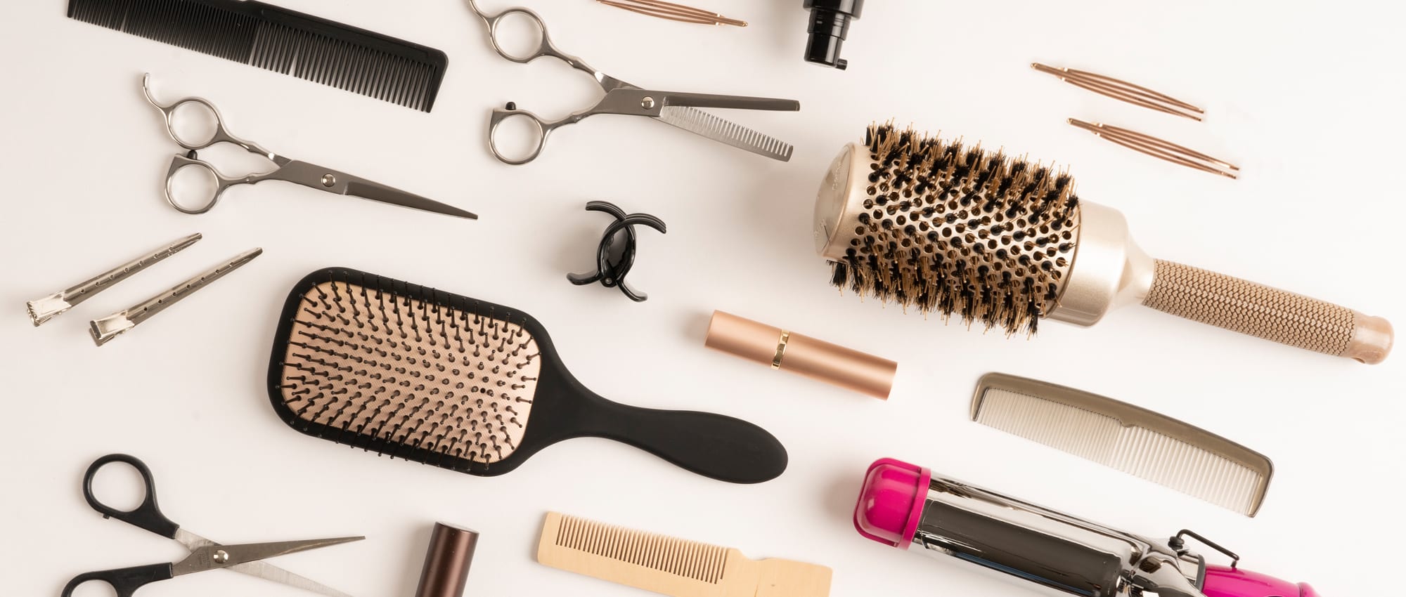 Haircare fulfillment products: brushes, combs, clips, and scissors.